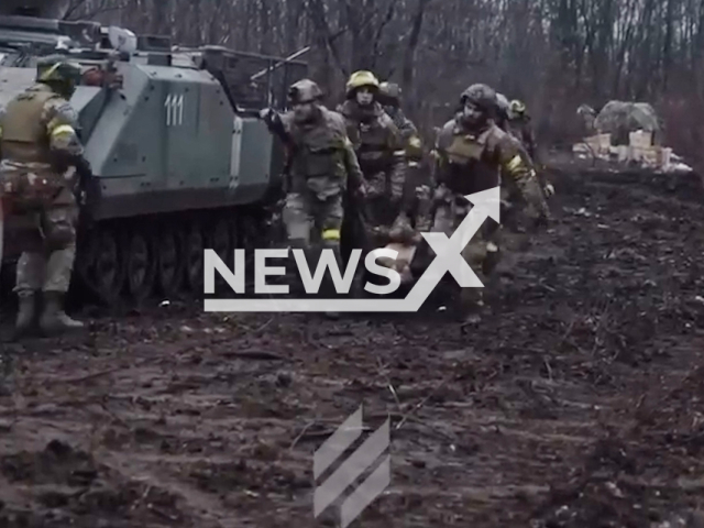 Ukrainian soldiers from Azov unit evacuate their wounded colleagues under fire in Bakhmut, Donetsk region, Ukraine. The footage was obtained from the Azov unit of the Special Operations Forces on Tuesday, Dec. 20, 2022. Note: Picture is screenshot from a video. (@sof_azov/Newsflash)