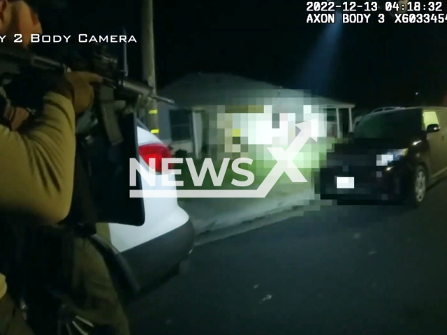 A police officer shoots the suspect in Stanislaus County, California, USA on Tuesday, Dec. 13, 2022. They later rescued people that barricaded themselves in rooms in the house and it was confirmed they had told police time that the shooter was drunk. Note: This picture is a screenshot from the video. (StanSheriff/Newsflash)