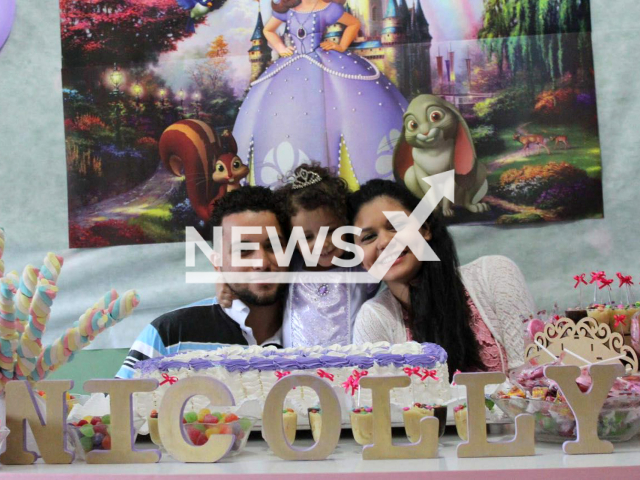 Cynthia Silva dos Santos, 25, Kervellin Wallace da Silva, 29,  and Nicolly Luize Dias da Silva, 8, pose in undated photo. The couple their daughters Nicolly and Emily Camile Dias da Silva, 3, and Kervellin's mother Denise Aparecida Dias da Silva, 51, drowned when the water level  suddenly increased  in Dois Corregos, Brazil, on Saturday, Dec. 24, 2022.
Note: Private photo.  (Newsflash)