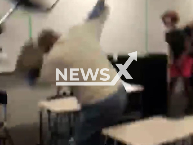 Students throwing chair at substitute teacher and he throws back at DeSoto West Middle School in Texas, United States. Note: This picture is a screenshot from the video (CEN).