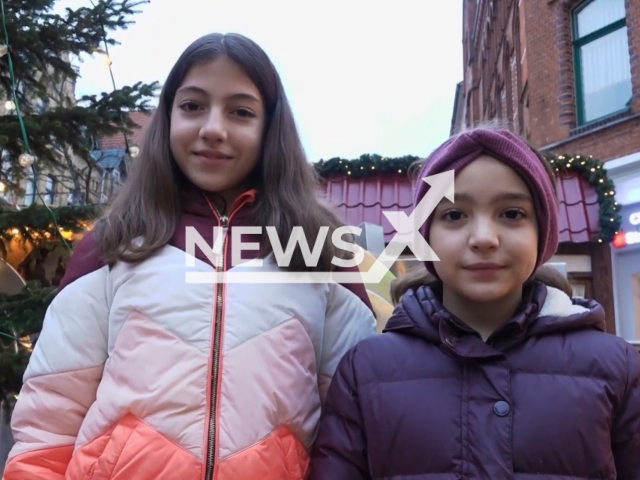 Picture shows Zohra, 13, (left) and Louisa Boucheloukh, 9, (right) in undated footage. The two sisters have raised hundreds of Euros to create a flower seed vending machine in a bid to ensure the existence of wild bee species. Note: Image is a screenshot from video. (Newsflash)