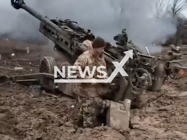 Ukrainian soldier shoots a howitzer in a muddy mess battlefield in harsh weather conditions in Ukraine. The footage was obtained from the Armed Forces of Ukraine on Wednesday, Dec. 28, 2022. Note: Picture is a screenshot from a video (@AFUkraine/Newsflash)