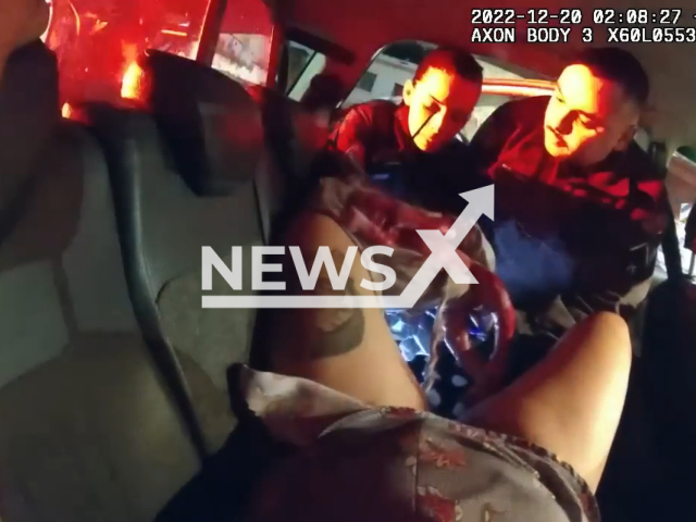 The picture shows the police officers helping a woman who gave birth in a car in Sao Paulo, Brazil on Tuesday, Dec.20, 2022. The mother and child were sent to the Leonor Mendes de Barros Maternity Hospital. Note: Police photo. (PMTV/Newsflash)