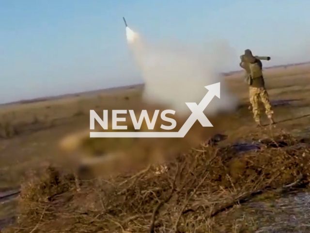 A Ukrainian soldier shoots rocket from MANPADS towards the Russian cruise missile in Ukraine in undated footage. The footage released by the Air Command "South" on Thursday, Dec. 29, 2022. Note: This picture is a screenshot from the video. (@PvKPivden/Newsflash)