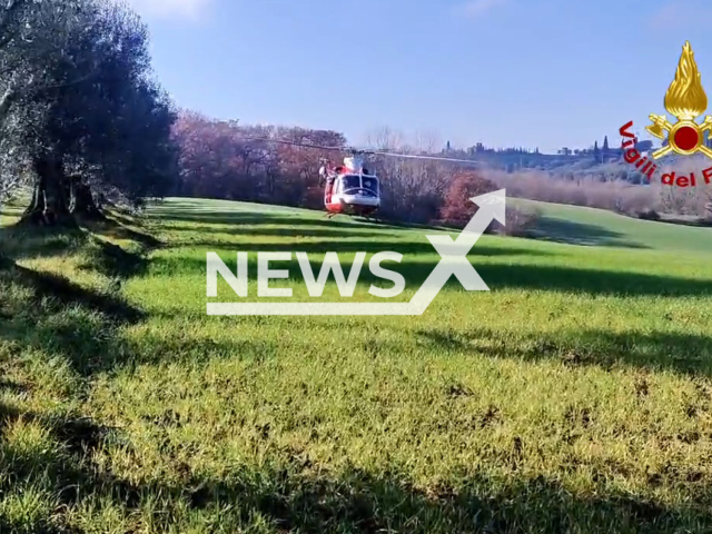 Firefighters rescue a man that was lost in woods in  Castiglione del Lago, Italy, undated. Note: Picture is  a screenshot from the video. (@vigilidelfuoco/Newsflash)