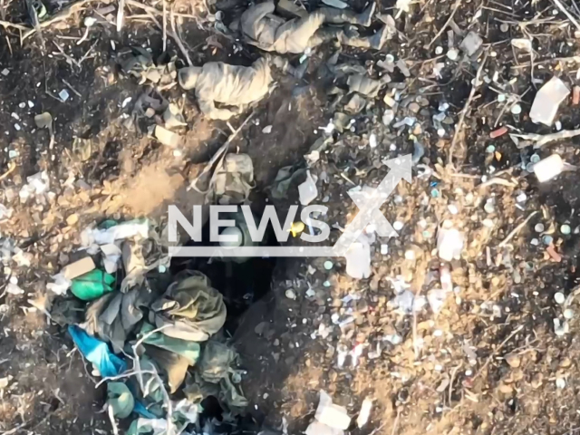 Drone operators drop bomb on Russian soldier hiding in foxhole near Bakhmut, Donetsk region, Ukraine. The footage was obtained from the Adam Joint Tactical Group on Saturday, Dec. 31, 2022. Note: Picture is a screenshot from a video (@adamtactic/Newsflash)