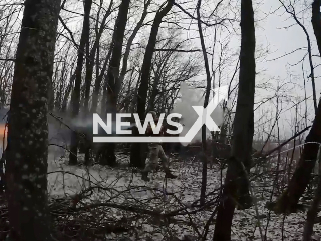 Ukrainian soldier shoots MANPADS (man-portable air-defense systems) among trees at Russian positions in Ukraine. The footage was obtained from the Regional Directorate of Territorial Defense Forces "East" of the Armed Forces of Ukraine on Saturday, Dec. 31, 2022. Note: Picture is a screenshot from a video (@troskhidzsu/Newsflash)