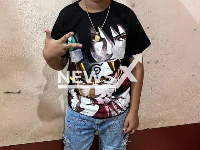 Juan Davi de Souza Faria, 11, poses in an undated photo. He was hit by a stray bullet in the first minutes of 2023 in Mesquita, Brazil. Note: Private photo. (Newsflash)