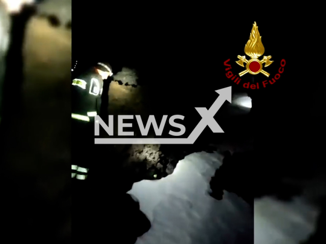 Firefighters rescue two 22-year-olds who ventured on the slope of the Etna volcano near the municipality of Catania, Italy,  on Monday, Jan. 2, 2023. The two people were in good health after the rescue. Note: This picture is a screenshot from the video.
(Vigili del Fuoco/Newsflash)