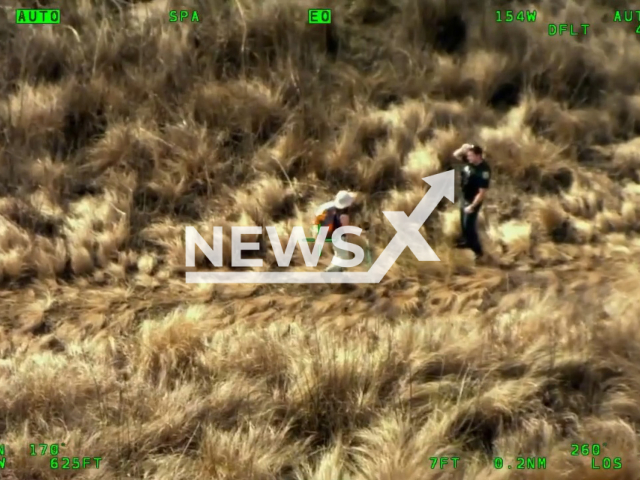 Deputies rescue a lost hiker after locating her with the help of a helicopter near the St. Johns River in east Orange County, Florida, USA, on Sunday, Jan. 1, 2023. The unnamed woman called emergency services after getting lost while hiking. Note: Photo is a screenshot from video (Orange County Sheriff's Office /Newsflash)