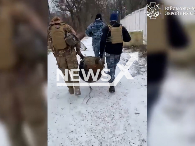 Soldiers of the Ukrainian naval special demining group carry an anti-ship mine near the sea coast of Odesa, Ukraine in undated footage. The footage was released by the Ukrainian Navy on Sunday, Jan. 8, 2023. Note: Picture is screenshot from a video (@navy.mil.gov.ua/Newsflash).