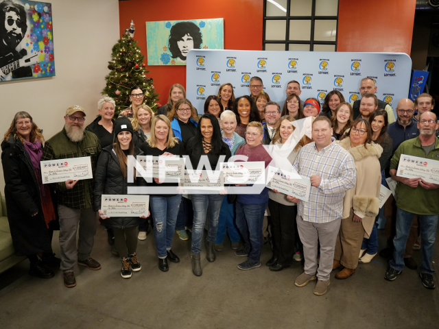 Photo shows members of The Heroes to Zeroooos Lottery Club, undated. The Heroes to Zeroooos Lottery Club, made up of 78 nurses, doctors, and other healthcare workers from Traverse City, Michigan, U. S. A., have claimed a USD 1 million Powerball prize. Note: Photo is from the Michigan Lottery (Michigan Lottery/Newsflash)