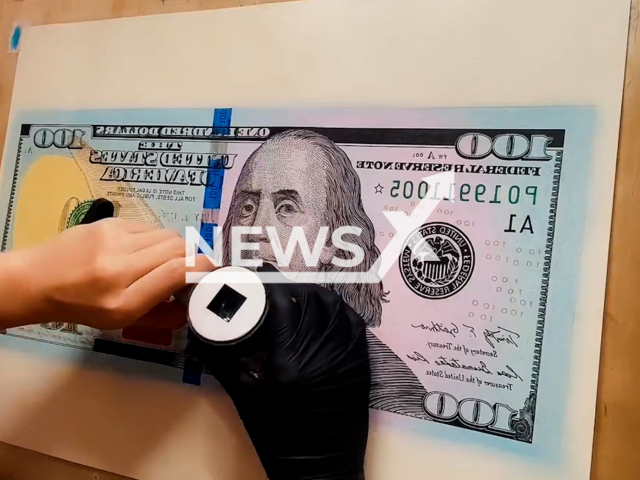 Shi Yunlong draws banknotes which look like real ones in Shenzhen, China, undated. His work also attracted the attention of the police. Note: Picture is screenshot from a video (Stone.hua/AsiaWire).