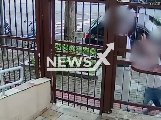 Two men robbing a woman when she arrived home in Diadema, Brazil. They fled with the victim's car and money, but were arrested on Thursday, Jan. 5, 2023. Note: Picture is screenshot from a video (PMTV/Newsflash).