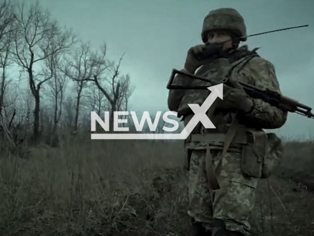 Picture shows a Ukrainian infantry soldier with military ammunition on the battlefield in Ukraine in undated footage. The footage was released by the 17th tank brigade of the Ukrainian Ground Forces on Tuesday, Jan. 10, 2023.  Note: Photo is a screenshot from a video. (@17otbr/Newsflash)