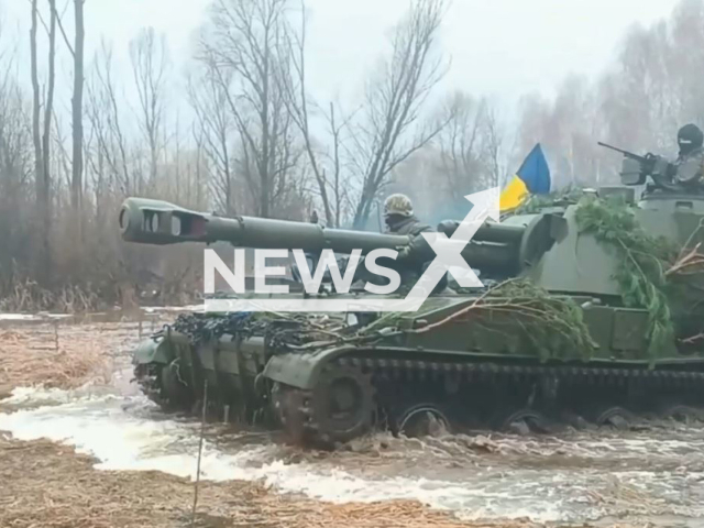 Ukrainian soldiers ride tank during joint staff training of the defense forces in a snowy forested area of Kyiv, Ukraine in undated footage. The footage was released by the Hetman Bohdan Khmelnytsky Independent Presidential Brigade on Tuesday, Jan. 10, 2023. Note: Photo is a screenshot from a video. (@Prezydentska.Bryhada/Newsflash)