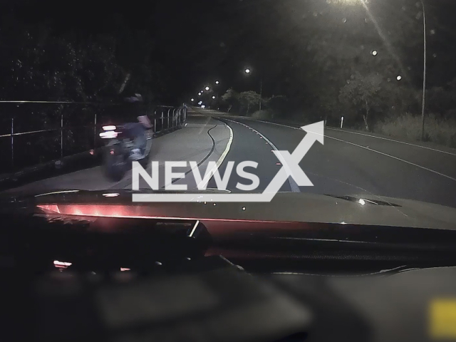 The moment motorcyclist crashes after police speeding intercept on 17th February 2022 in Mackay Harbour, Australia. Note: Picture is a screenshot from a video (Police Mackay/Newsflash)