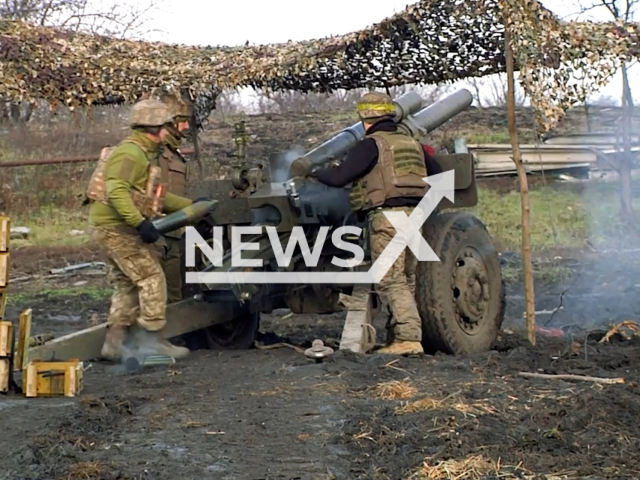 Ukrainian mortars load a rocket and shoot at Russian occupiers in Ukraine in undated footage. The footage was released by the 66th brigade of the Ukrainian Ground Forces on Wednesday, Jan. 11, 2023. Note: Picture is a screenshot from a video. (@66ombr/Newsflash)