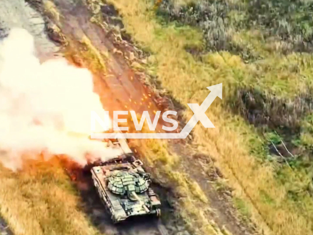 Damaged Russian tank burns in Donetsk region, Ukraine in undated footage. The footage was released by the 79th Air Assault Brigade of Mykolaiv on Thursday, Jan. 12, 2023. Note: Picture is a screenshot from a video. (@79AMBUA/Newsflash)