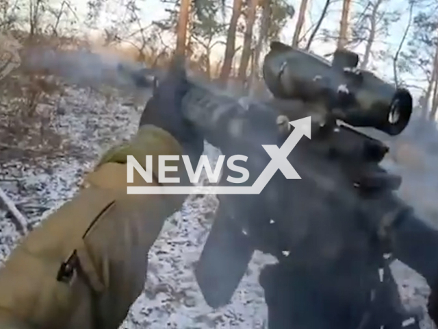 Ukrainian Special Operations soldier fire from machine guns at the Russian occupiers in the forest battle in Luhansk region in Ukraine in undated footage.
The footage released by the Special Operations Forces on Friday, Jan. 13, 2023. Note: This picture is a screenshot from the video. (@usofcom/Newsflash)