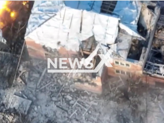 Picture shows an explosion at a building with Russian soldiers in Bakhmut, Donetsk region, Ukraine in undated footage. The footage was released by the Khartiia voluntary unit on Friday, Jan. 13, 2023. Note: Picture is screenshot from a video. (@khartiia/Newsflash)