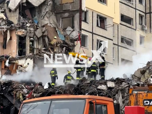 Ukrainian rescuers save a woman from destroyed building after Russian missile strike in Dnipro, Ukraine on Sunday, Jan. 15, 2023. The footage was released by the main department of the State Emergency Service of Ukraine in the Dnipropetrovsk Oblast. Note: Picture is screenshot from a video. (@MNSDNE/Newsflash)