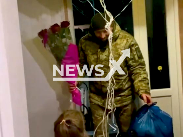 Description: Little girl Liza, 3, meets her grandfather Serhii, a Ukrainian border guard, at home after his service in Bakhmut, Donetsk region, Ukraine. The footage was released by the State Border Service of Ukraine on Sunday, Jan. 15, 2023. Notes: Picture is screen from video.(@dpsu.gov.ua/Newsflash)