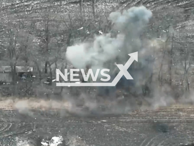 Picture shows an explosion of Russian positions among trees in Luhansk region, Ukraine. The footage was released by the State Border Service of Ukraine on Saturday, Jan. 14, 2023. Note: Picture is screenshot from a video.(@dpsu.gov.ua/Newsflash)