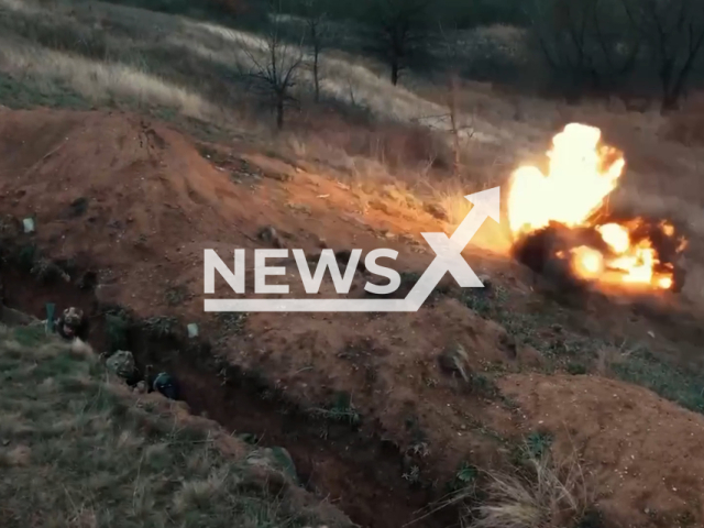 Description: Picture shows fighters of pro-Ukrainian the Kastuś Kalinoŭski Regiment formed from Belarusian volunteers in a trench near explosion during combat training in Ukraine in undated footage. The footage was obtained from the Kastuś Kalinoŭski Regiment on Saturday, Jan. 14, 2023. Notes: Photo is screen from video.(@belwarriors/Newsflash)