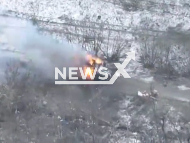 Description: Damaged Russian military vehicle burns in a snowy field in Bakhmut, Donetsk region, Ukraine in undated footage. The footage was released by the 28th brigade of Ukrainian Ground Forces on Monday, Jan. 16, 2023. Notes: Picture is screen from  video.(@28brigade/Newsflash)