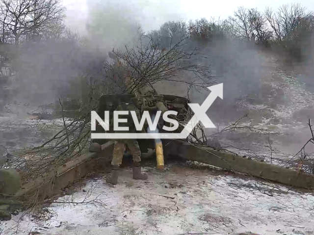 LPR and Russian artillerymen shoot at Ukrainian positions using howitzer in Ukraine in undated footage. The footage was released by the People's Militia of the LPR on Monday, Jan. 16, 2023. Note: This picture is a screenshot from the video. (@millnr/Newsflash)