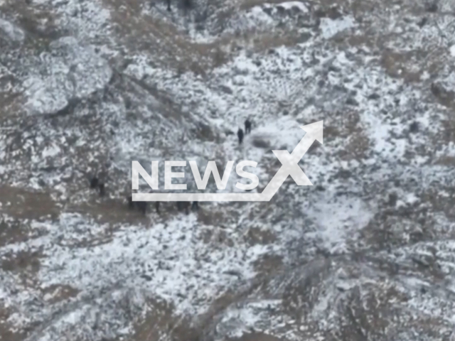 Picture shows the assault group of Russian invaders in a snowy field in Avdiivka, Donetsk region, Ukraine in undated footage. The footage was released by the 36th brigade of Ukrainian Navy on Monday, Jan. 16, 2023. Note: Picture is screenshot from a video. (@36obmp/Newsflash)