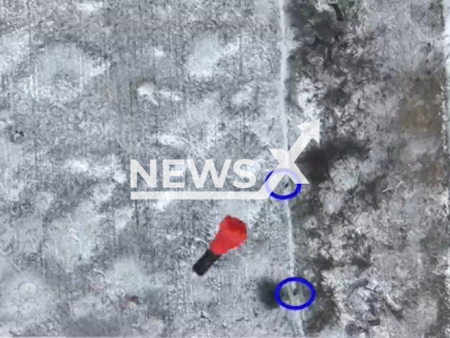 Bomb falls on Ukrainian soldiers on a snowy road in Ukraine in undated footage. The footage was released by the People's Militia of the DPR on Tuesday, Jan. 17, 2023. Note: Picture is screenshot from a video. (@nm_dnr/Newsflash)