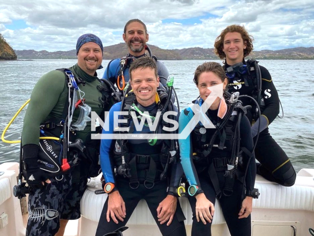 Diving instructor, Nathan Mobach (far left), poses with Kraken Divers' owner, Daniel Miranda (middle), Nathan's colleague, Nico (far right), and Nathan's students, Nicole and Estaban, in an undated photo. Nicole and Estaban were Nathan's first Advanced Open Water students. Note: We obtained permission for this photo. (Nathan Mobach; Kraken Divers/Newsflash)