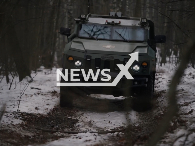 Ukrainian-made "Novator" specialized armored vehicle moves down the snowy road in Ukraine in undated footage. The footage was released by the 1st Presidential brigade of the National Guard of Ukraine on Thursday, Jan. 12, 2023. Note: Picture is screenshot from a video. (@ngu_3027/Newsflash)