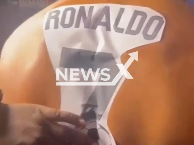 Description: Tattoo artist applies tattoo stencil on the back of Parthiban, 28, in Coimbatore, located in the Indian state of Tamil Nadu, in undated footage. Parthiban is a huge Ronaldo fan, and according to him, he loves Ronaldo's attitude and hardwork. Notes: Picture is screen from a video.(@mr_____cocktail/Newsflash)