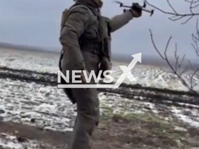 Description: Picture shows a Ukrainian soldier with a drone in Luhansk region, Ukraine in undated footage. The footage was released by the 3rd regiment of the Ukrainian Special Operations Forces on Wednesday, Jan. 18, 2023. Notes: Picture is screen from a video.(@3po1k/Newsflash)