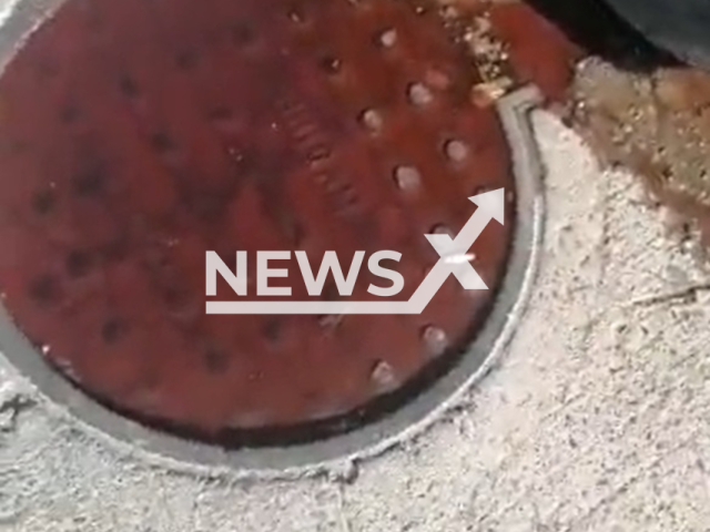 Picture shows blood flowing on the street of Guasave, Mexico, undated. Local media said the cause is believed to be  a local funeral home and the poor drainage service in the area. Note: Photo is a screenshot from a video. (Newsflash)