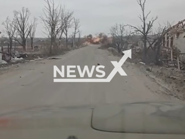 Description: Russian shell falls in front of the car of Ukrainian soldiers on the road of a residential area in Ukraine in undated footage. The footage was released by the 25th brigade of the Ukrainian Air Assault Forces on Thursday, Jan. 19, 2023. Notes: Photo is screen from a video.(@Airborne1126/Newsflash)