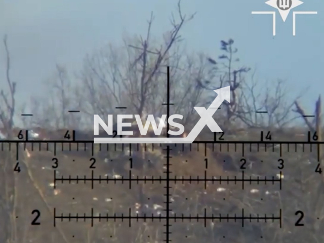 Description: Ukrainian sniper aims at Russian soldiers in Bakhmut, Donetsk region, Ukraine in undated footage. The footage was released by the 28th brigade of the Ukrainian Ground Forces on Wednesday, Jan. 18, 2023. Notes: Photo is screen from a video.(@28brigade/Newsflash)