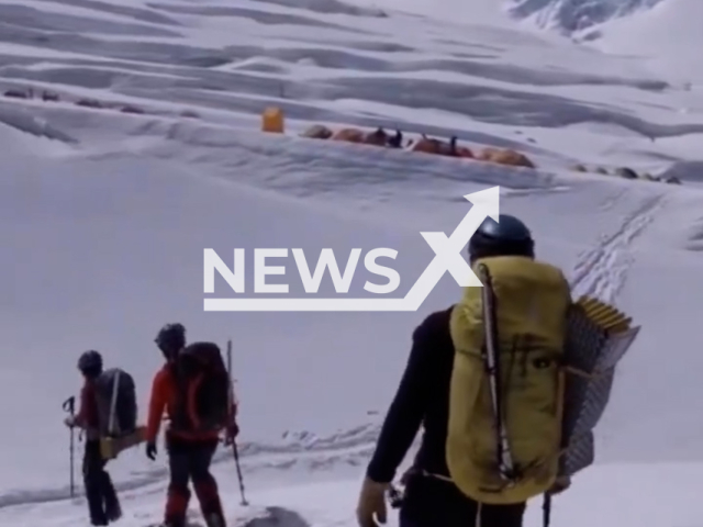 Description: Taylor Adams, 33, ventures through Everest’s Western Cwm in the vicinity of Camp I alongside other climbers, in undated footage. Taylor first started mountaineering in college. Notes: Picture is screen from a video.(@climbtocurediabetes/Newsflash)