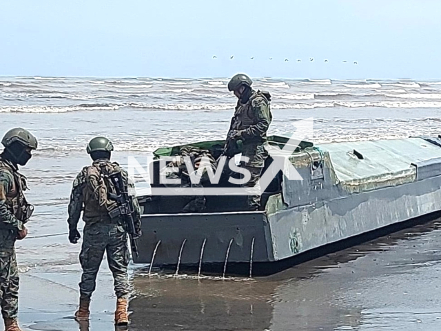 Picture shows authorities   investigating the semi-submersible vessel, used to transport controlled substances that was found on the border with Colombia, in Esmeraldas, Ecuador, undated. Investigative units were deployed in various places to determine who owned the semi-submersible vessel.   Note: Licensed photo.   (@FFAAECUADOR/Newsflash)