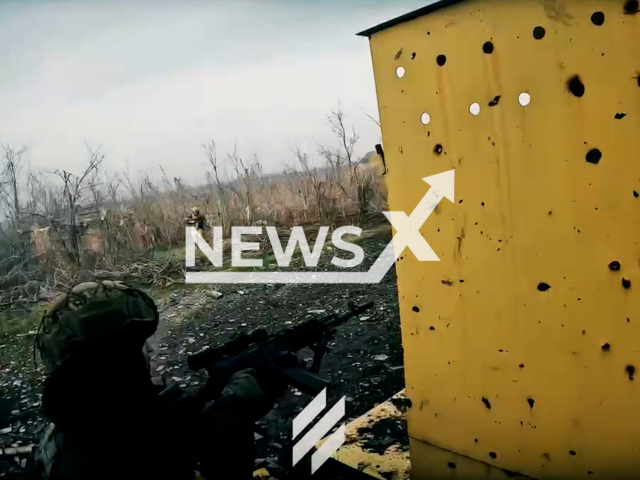 Description: Ukrainian soldier shoots at Russian troops covering his colleague during assault operation in Bakhmut, Donetsk region, Ukraine in undated footage. The footage was released by the Azov unit on Thursday, Jan. 19, 2023. Notes: Picture is screen from a video.(@AZOVsof/Newsflash)