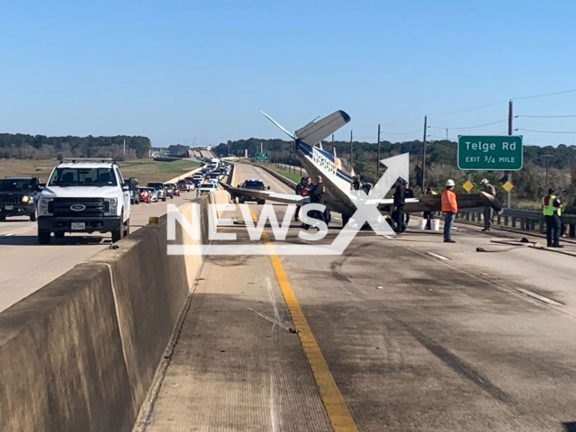 Picture shows the  small airplane on the  highway in Harris County, Texas, USA, on Sunday, Jan. 22, 2023. It crashed  and caught, the fire pilot was not injured.
  Note: Police photo. (@TxDPSSoutheast/Newsflash)