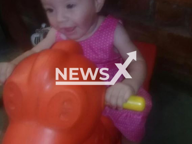 The victim, Milena, 2, poses in undated photo. Her mother Milagros Esther Torres, 22,  took her  to the  hospital dead in Merlo, Argentina, on Tuesday,  Jan. 17, 2023,   saying she had fallen out of bed but  the autopsy confirmed  the girl had been murdered Note: Private photo.  (Newsflash)