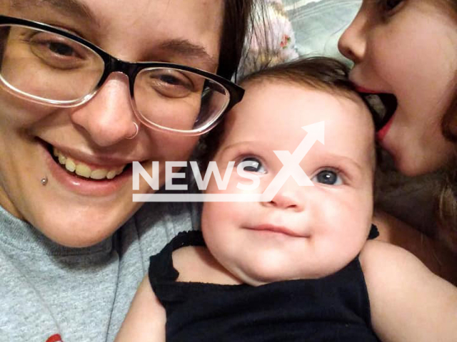 Genny Fitzpatrick, 30, and her daughters Peyton Tyler, 9, and Kourtney Tyler, 1,  pose in undated photo. They died in a house fire in Topeka, Kansas, USA, on Friday, Jan. 20, 2033, authorities believe was intentionally set by the victims boyfriend Kyle J. Tyler, 32.
Note: Private photo.  (Genny Fitzpatrick/Newsflash)