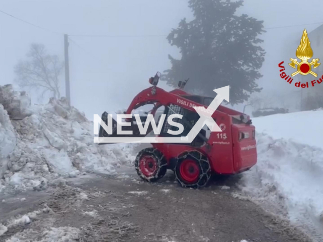 Firefighter removes snow in Pezzano, in the municipality of Montecopiolo, Italy. undated. Firefighters in the area are looking for a missing 69-year-old woman. Note: Photo from fire brigade. (Vigili del Fuoco/Newsflash)