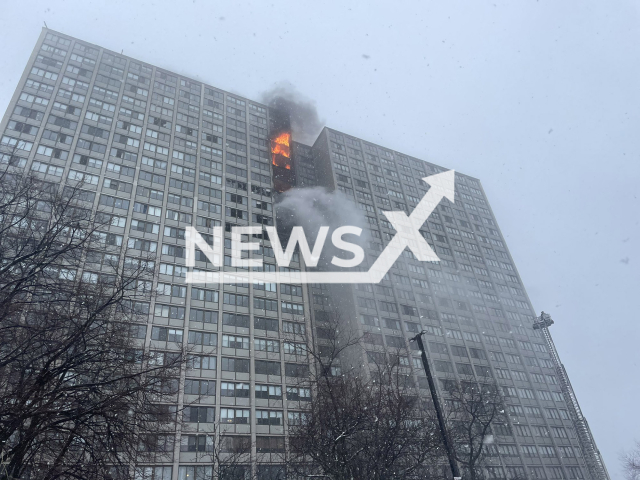 Harper Square cooperative residential building in the Kenwood neighborhood of Chicago, USA, burns on Wed., Jan. 25, 2023. The Chicago Fire Commissioner says the fire began on the 15th floor and traveled up to the 24th floor as firefighters worked to put it out. Note: Photo is from the Chicago Fire Media (@CFDMedia/Newsflash)