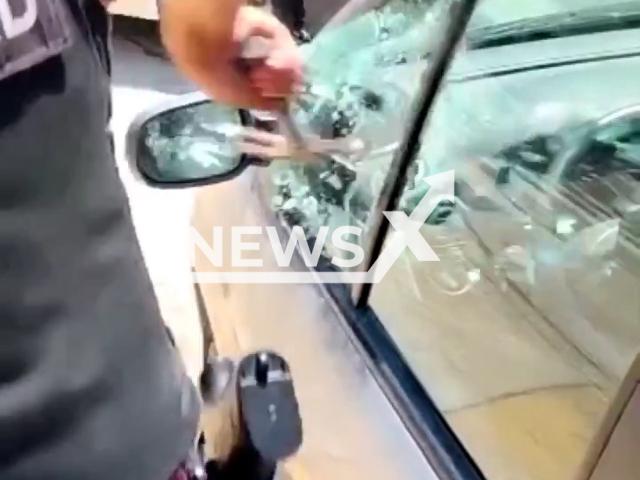 Police rescue a child locked up inside a vehicle in Santa Rita, Buenos Aires, Argentina, Thursday, Jan. 26, 2023. An investigation was initiated following the incident.Note: Picture is screenshot from a video. (@policiadelaciudad/Newsflash)