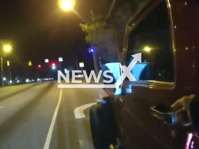 Image shows a patrol car being hijacked during a routine traffic stop, undated photo. Suspect Mickal Parker, 29, was arrested and sent to the Fulton County Jail, in the city of Atlanta, Georgia, USA, on Saturday, Jan. 28, 2 Note: This picture is a screenshot from the video. (City of Atlanta Police Department/Newsflash)